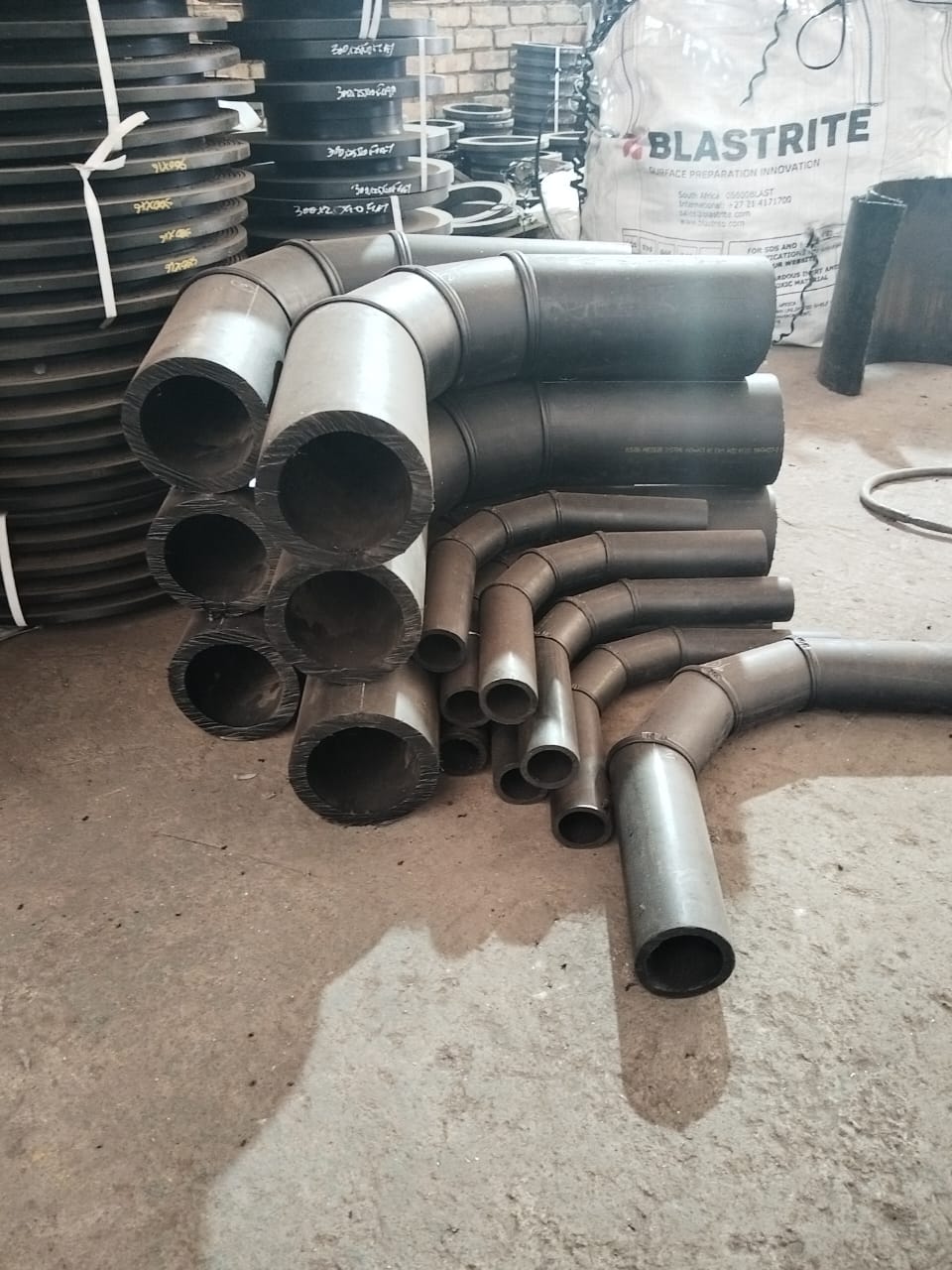 HDPE slurry pipe bends and liner stock in the Wetpipe fabrication workshop
